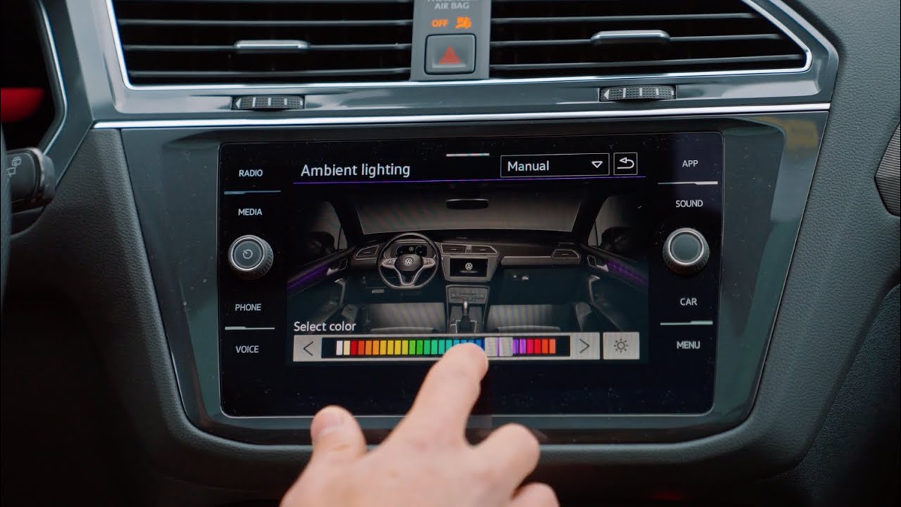 Automotive cockpit ambient lighting light guide system—RGB LED strips creating an immersive optical environment (Image Source: YouTube)